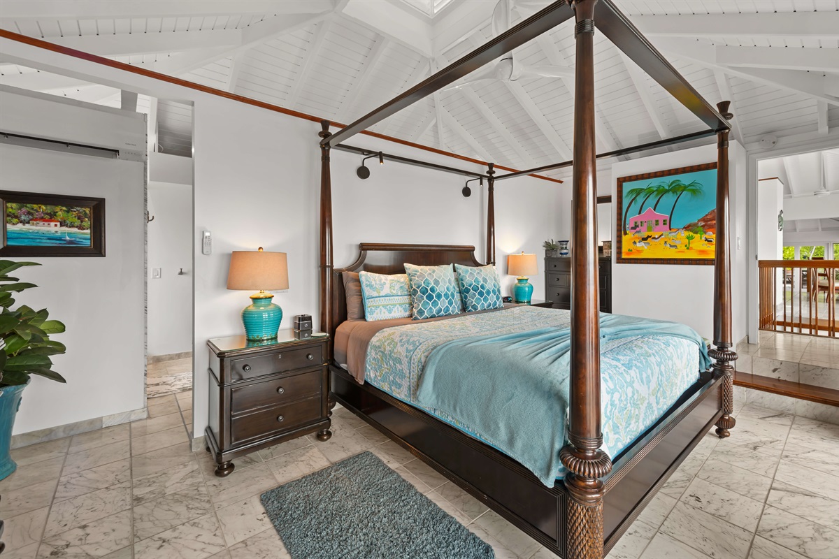 A king bed, ensuite bathroom and balcony access in the primary bedroom.