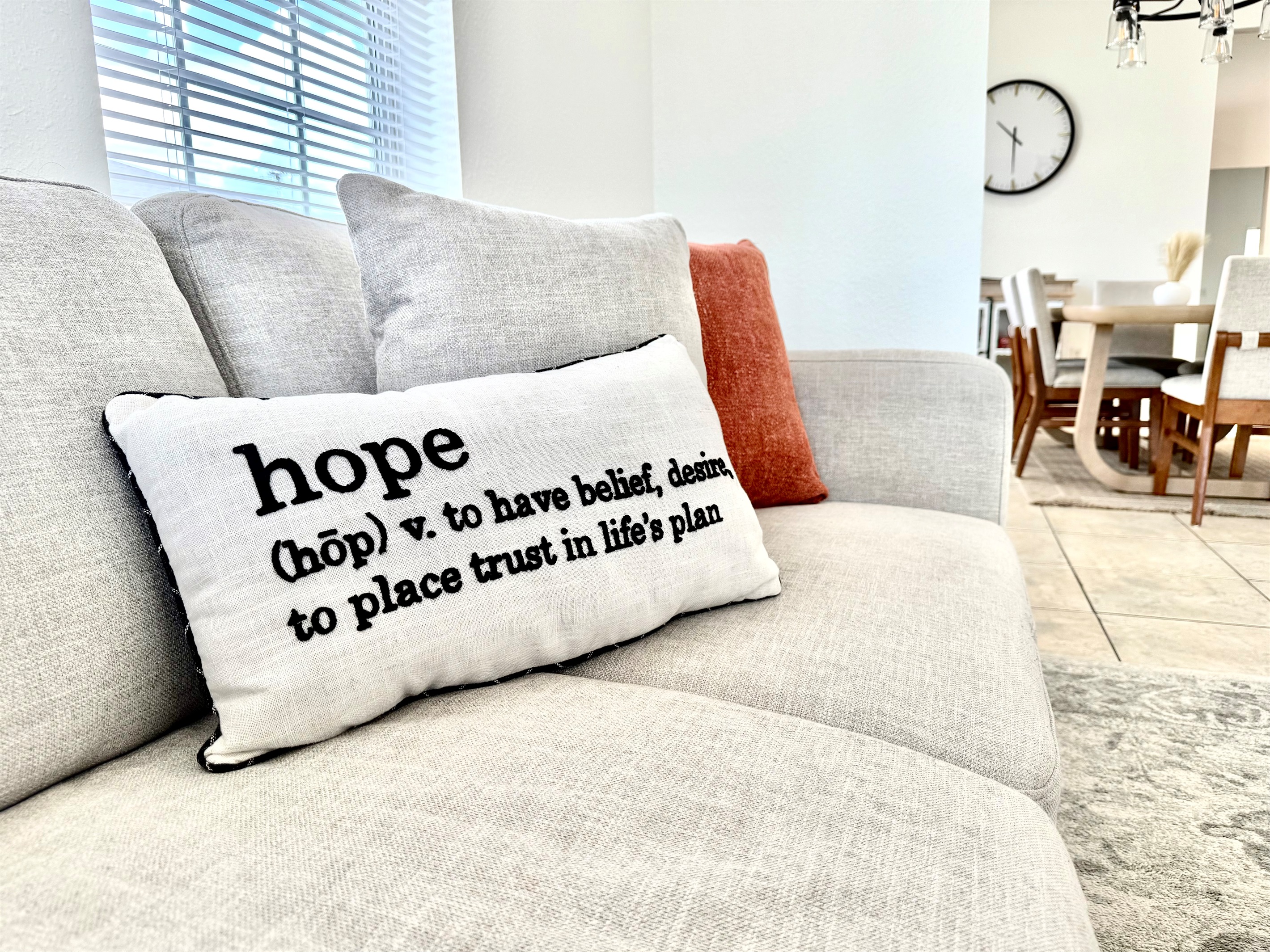 With two large sofas, warm accent pillows, and a classic coffee table setup, it's the perfect spot for family movie nights or laid-back mornings with coffee.