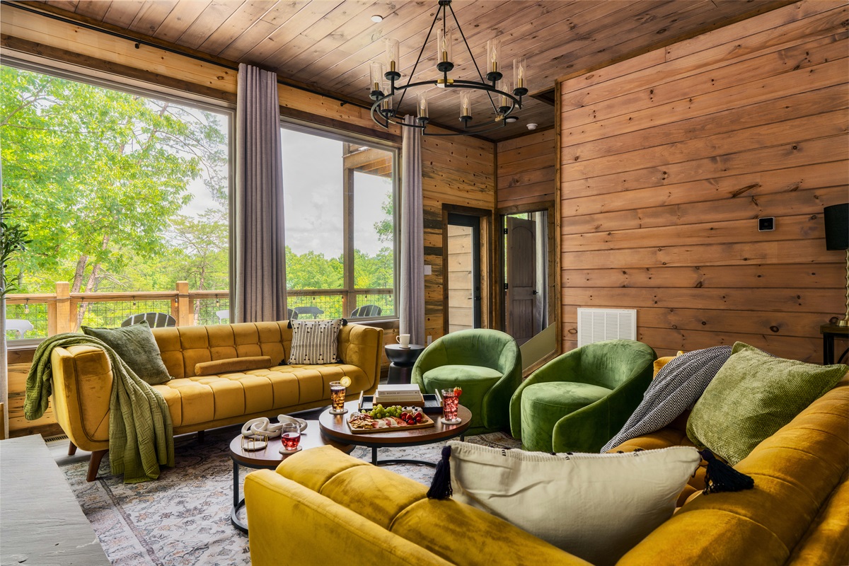 Stylish living room with plush seating & electric fireplace, perfect for family time