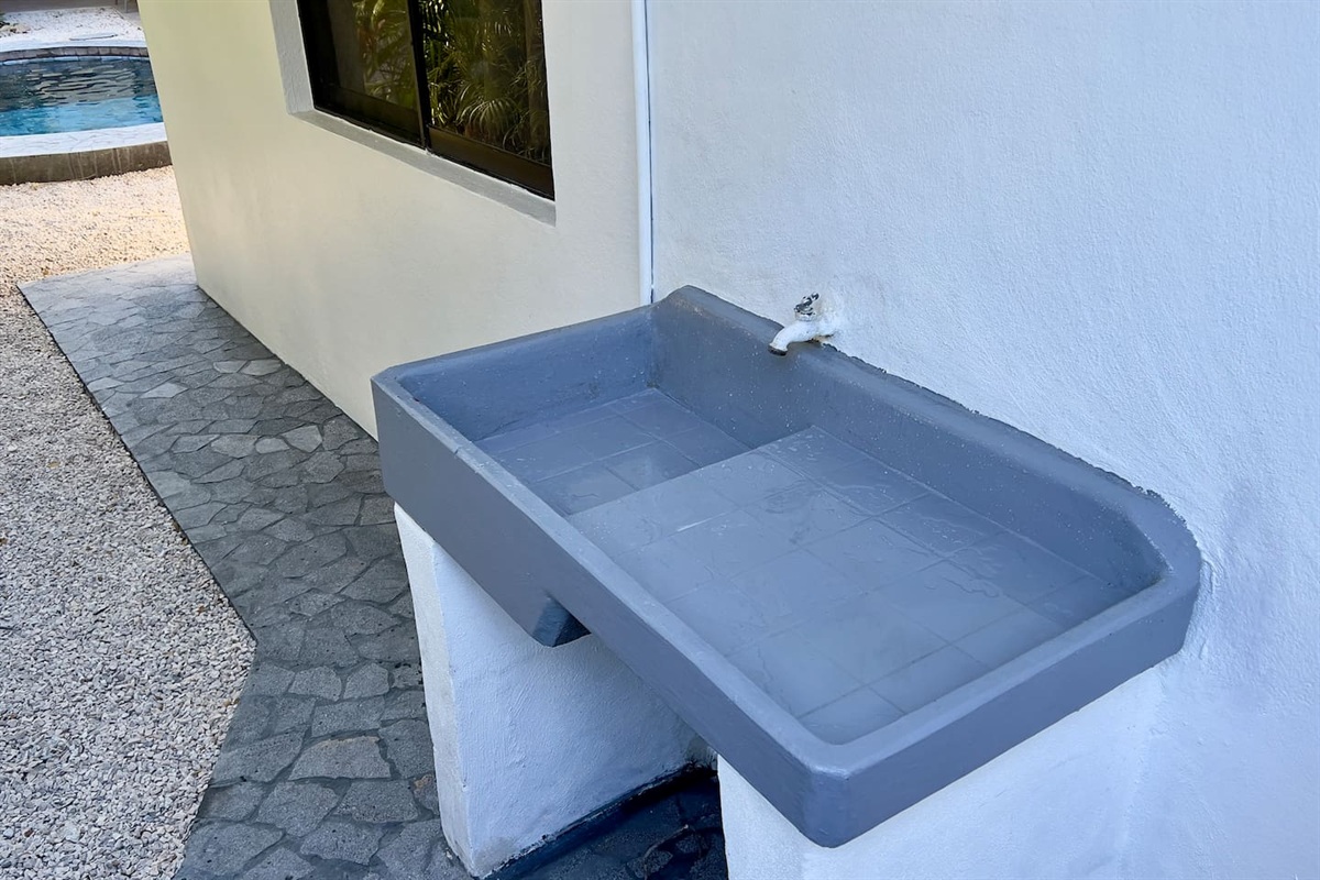 Outdoor sink is perfect for cleaning beach toys and other items so you don't need to bring them inside.  