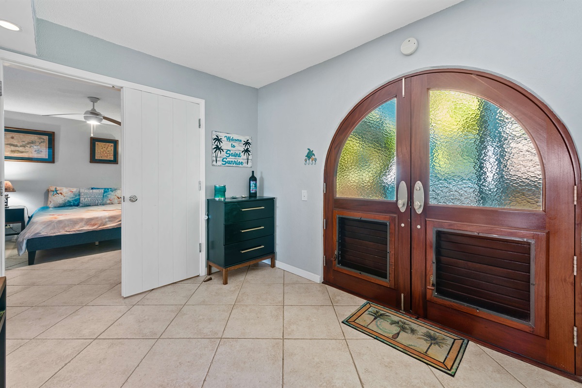 Wake up to sunlight streaming through large windows in the stylish primary suite.