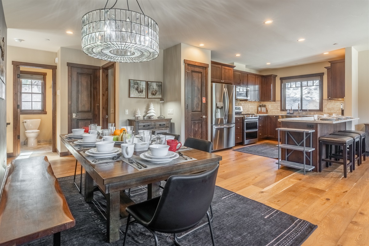 This spacious dining room with a roomy bench table is your go-to spot for shared meals, friendly competitions, or a productive workday—because sometimes, the best ideas happen over good food and great company.