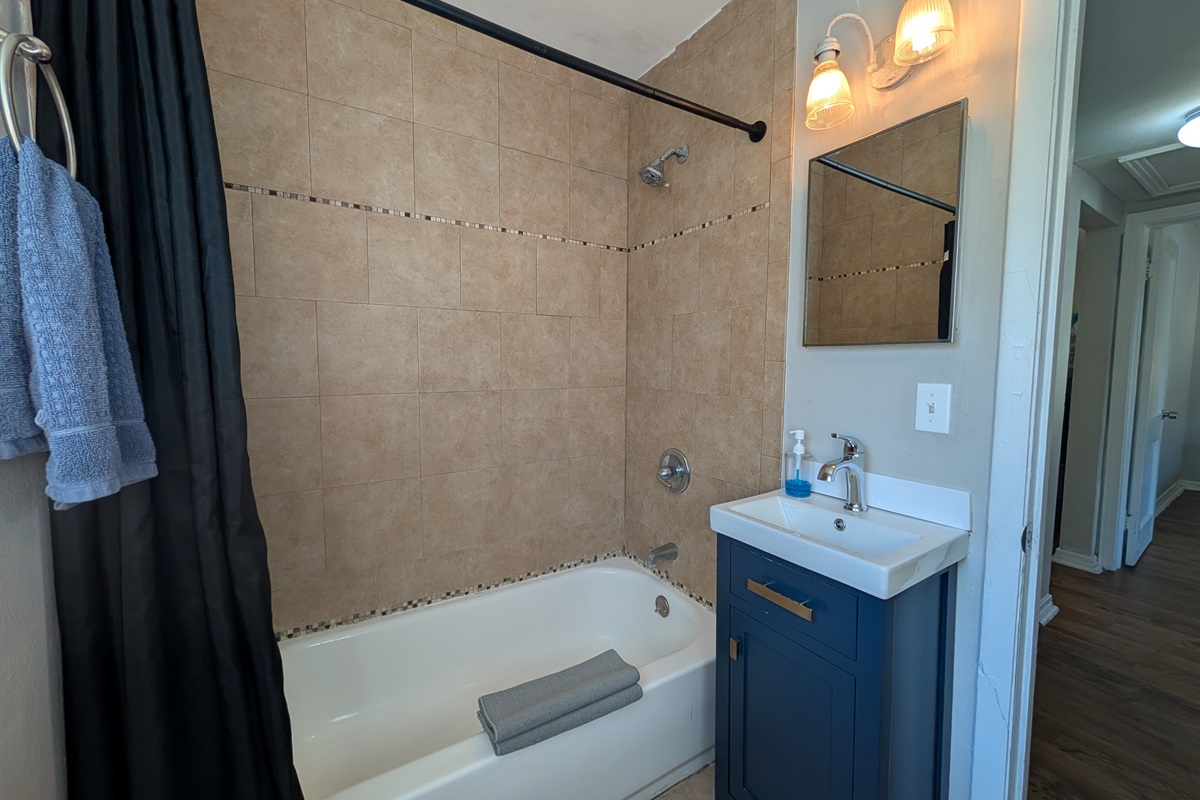 Full bathroom with bathtub and shower