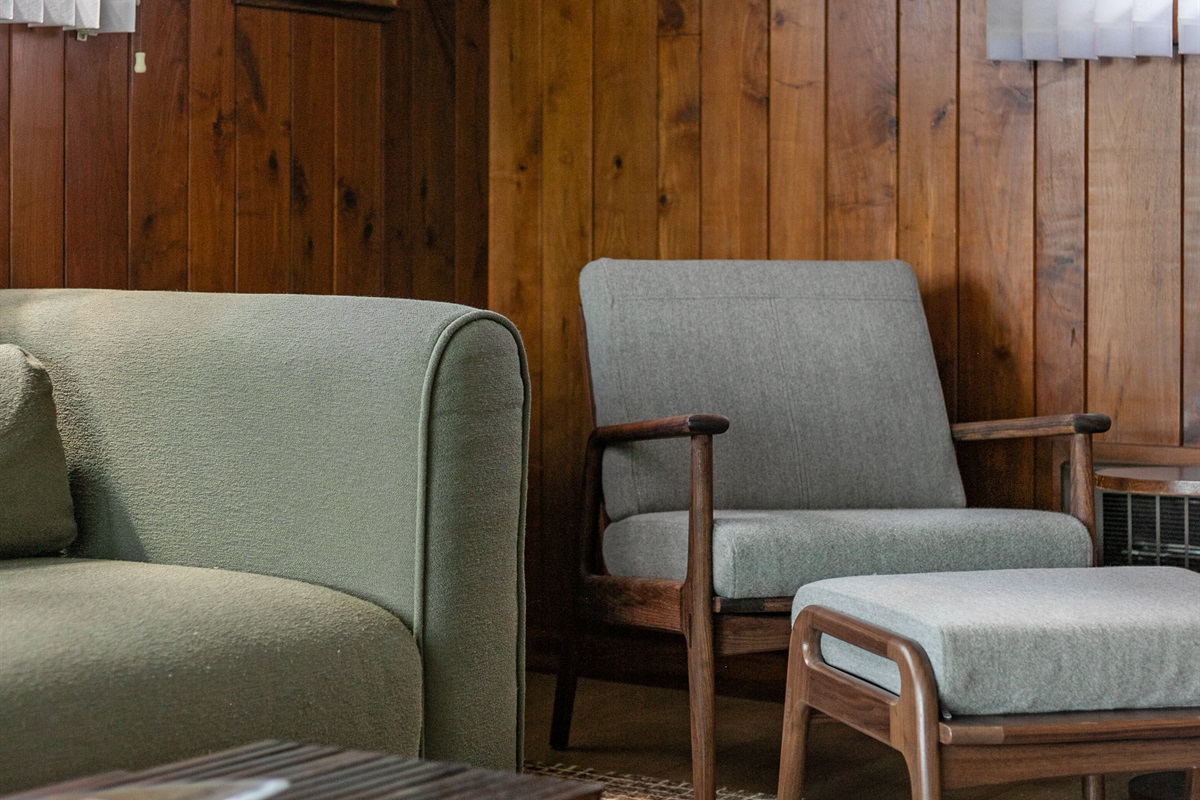 With plenty of seating for everyone, the living room is designed for gathering together, whether to watch a movie, play games, or simply relax.