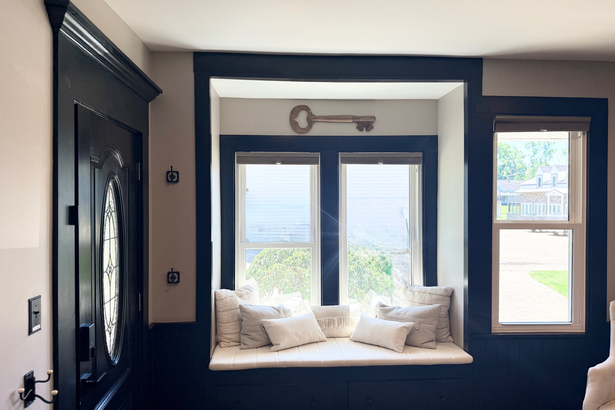 Window reading nook with soft cushions and abundant natural light.