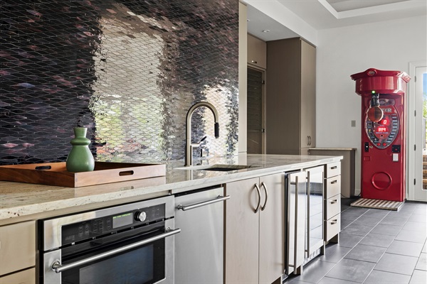 Gameroom Kitchen includes wine refrigerator and ice machine.  Gameroom has direct access to pool area. 