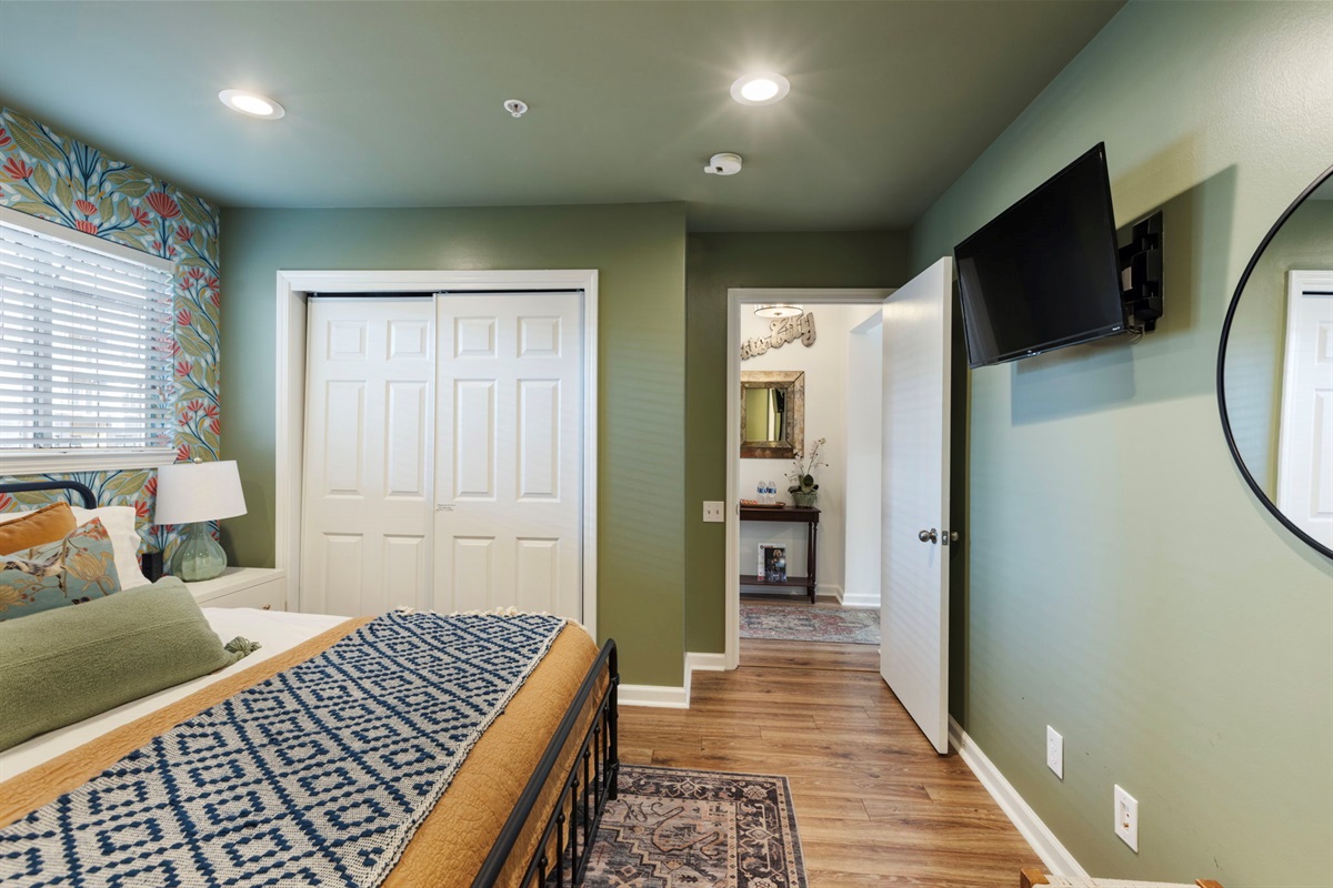 Primary bedroom with television