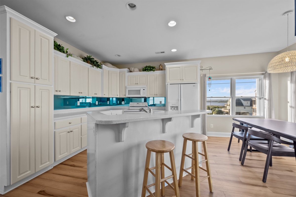 Fully stocked kitchen with pots, pans, utensils, and more – just bring your groceries!