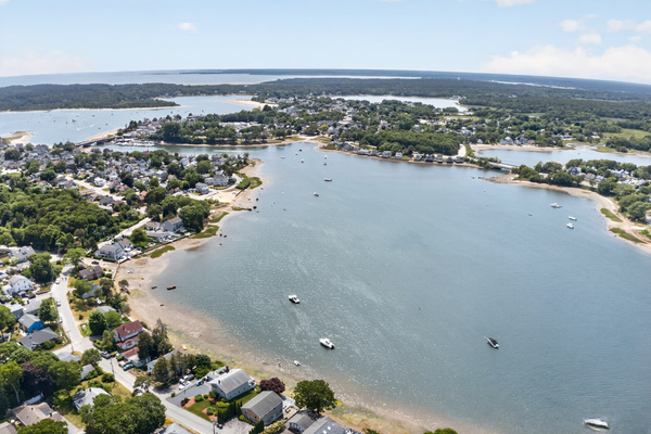 Sweeping aerial view of the bay and surrounding coastline, showcasing the area's natural beauty.