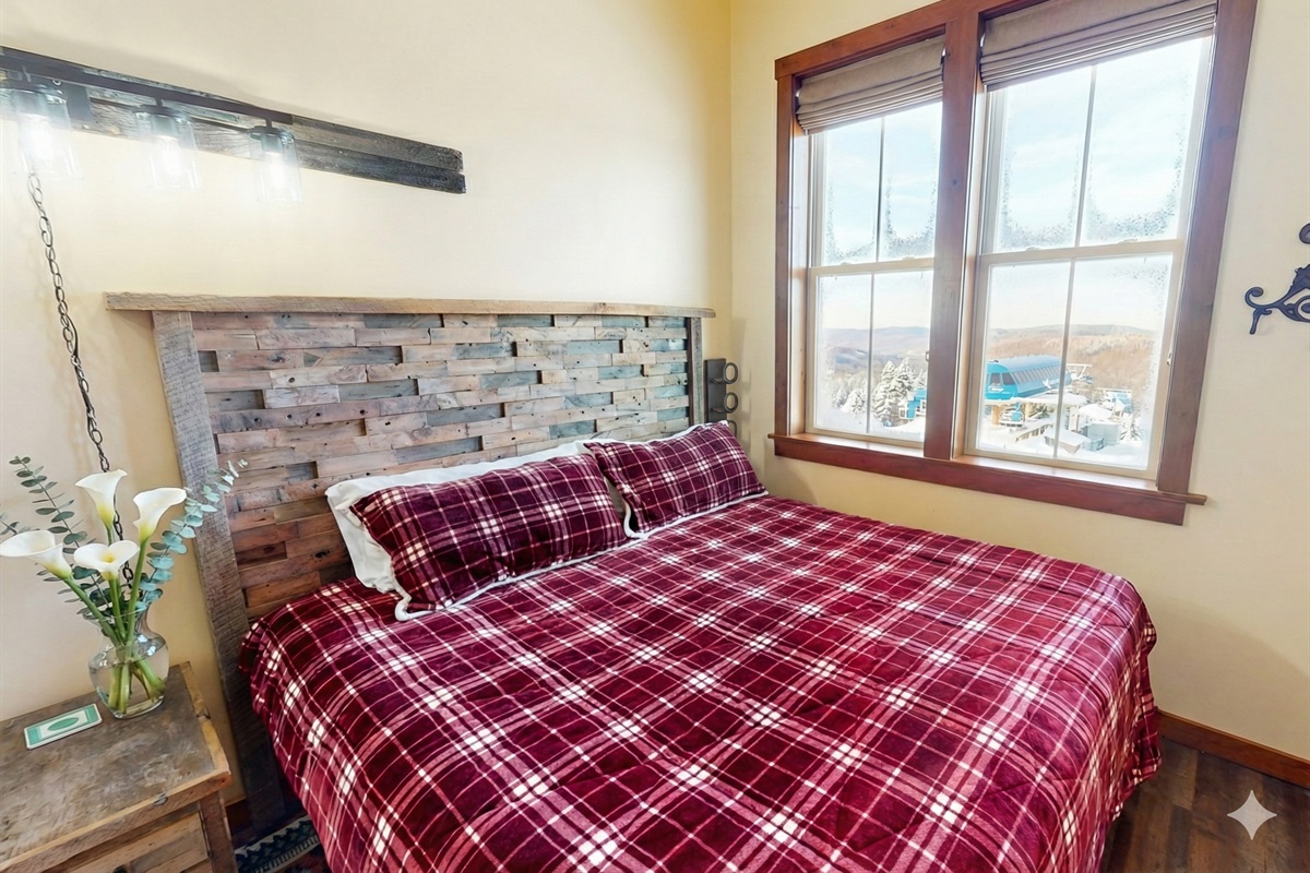 Cozy alpine-style bedroom featuring handcrafted wood headboards and soft linens.