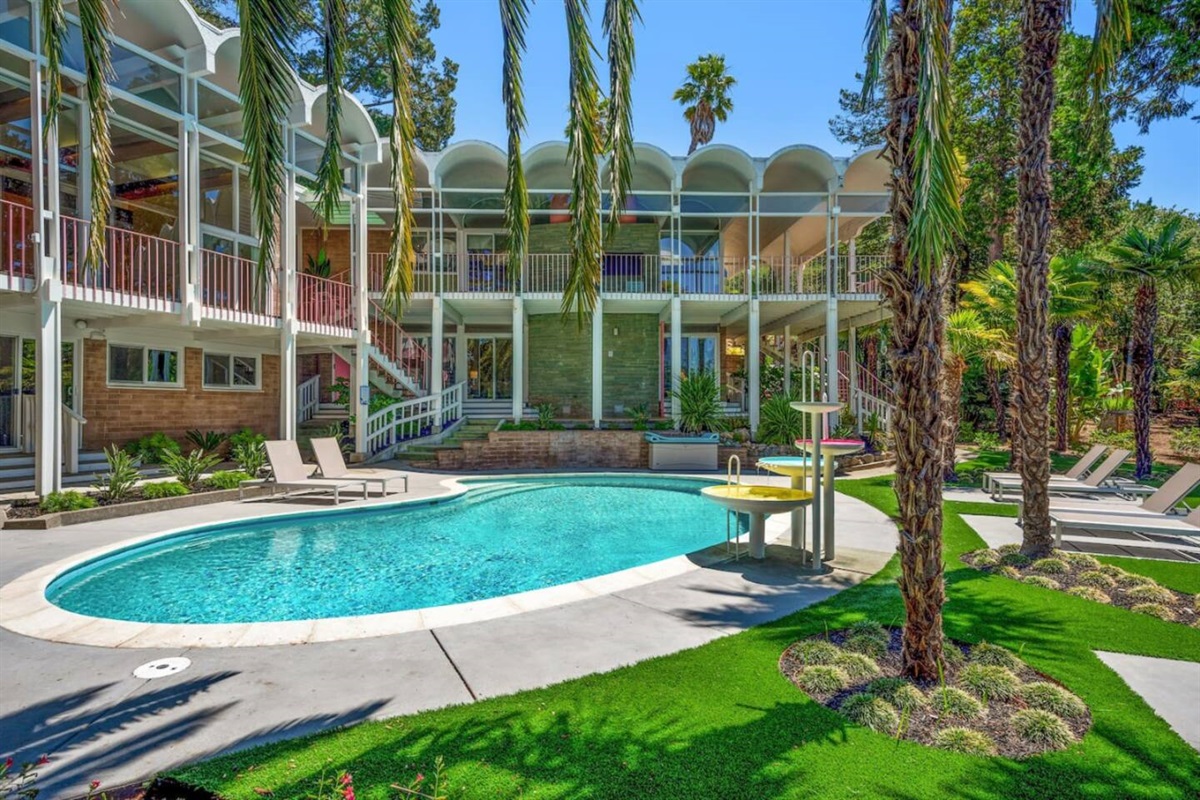 Hot tub is on the concrete pad immediately to the right of this photo