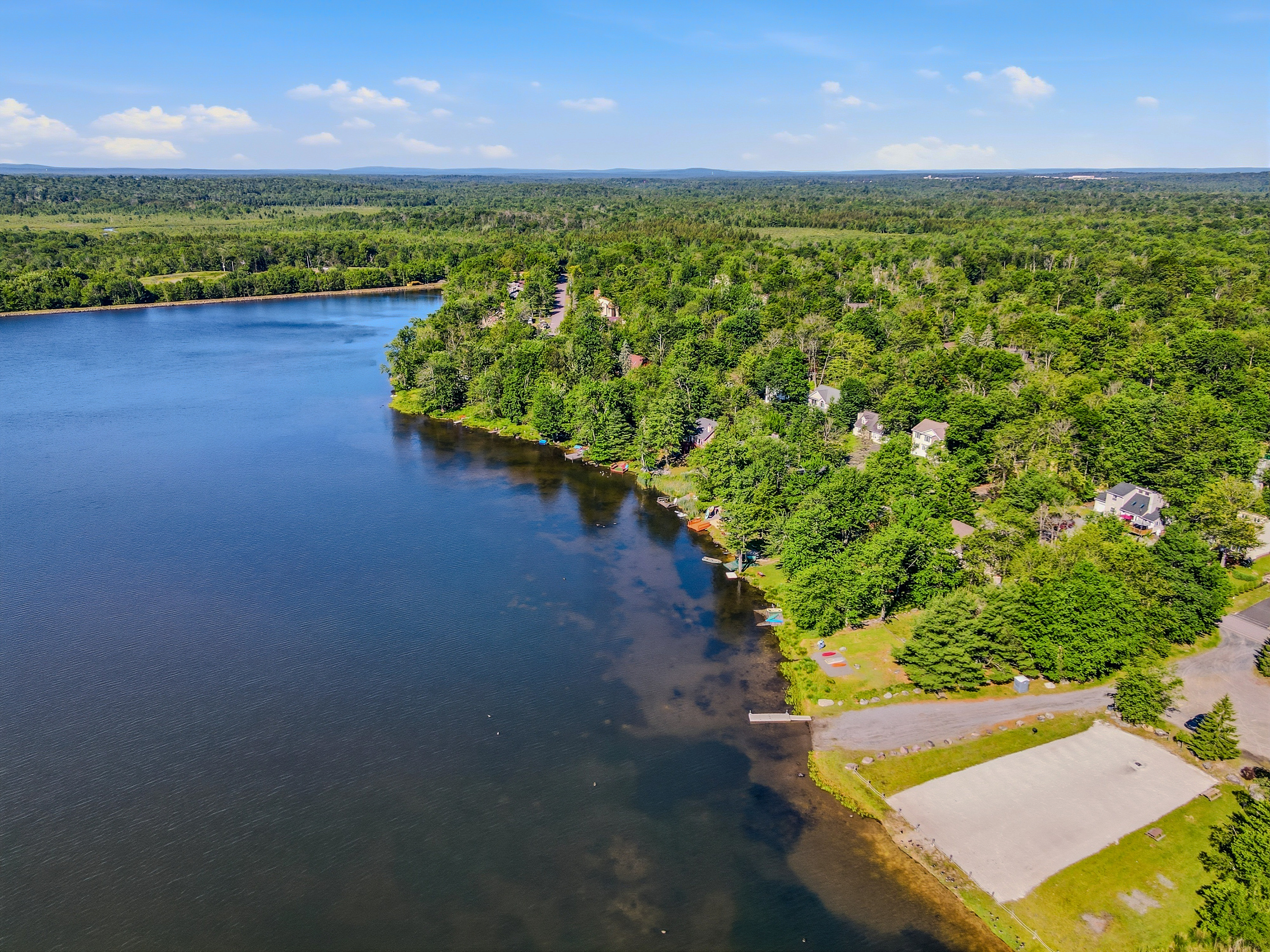 Aerial view of Lake Carobeth — the full lake expanse and wooded shoreline
