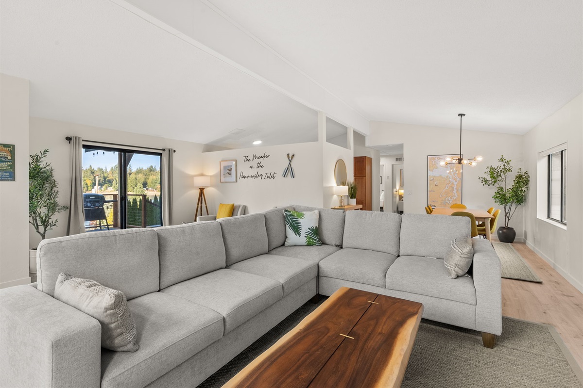 Relax in the cozy living and dining area, with easy access to the spacious deck—perfect for indoor-outdoor living