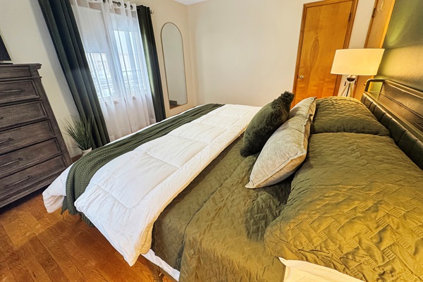 Mid-century elegance meets modern luxury in this beautifully appointed king bedroom.