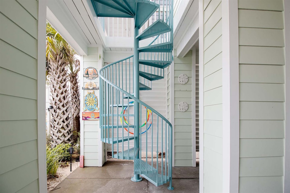 Stairs from the second floor's balcony to the backyard