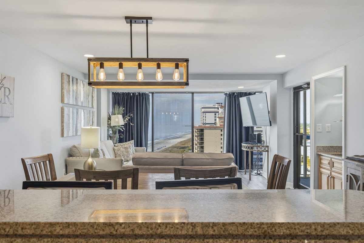 Dining table with ocean views beyond the living room
