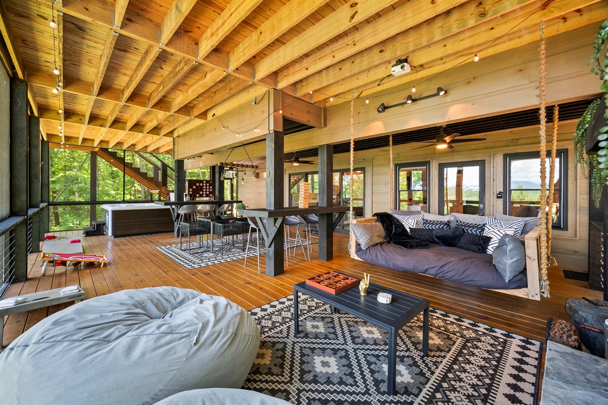Relax around the swing bed and fireplace, immersed in forest tranquility.