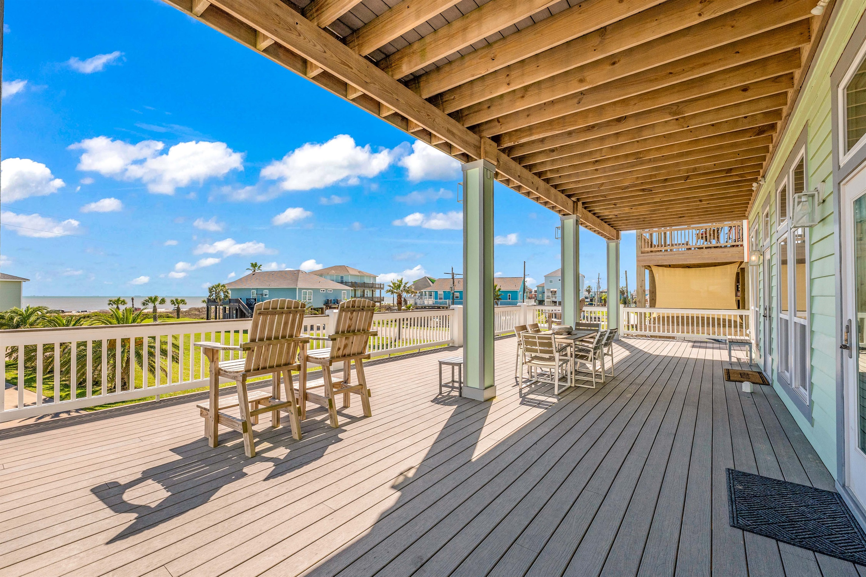 Crystal Paradise Outdoor Space: Sip your morning coffee or watch the sunset from the balcony, where comfy seating meets breathtaking ocean views.