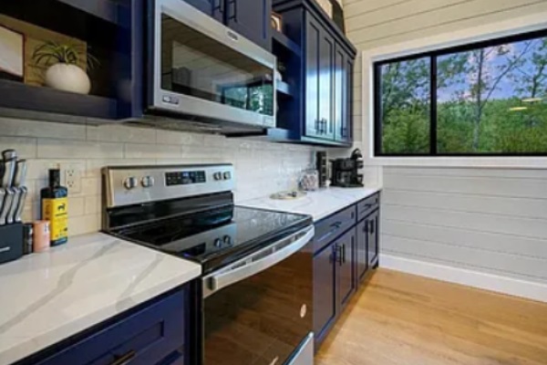 Fully equipped kitchen with sleek appliances and scenic window views