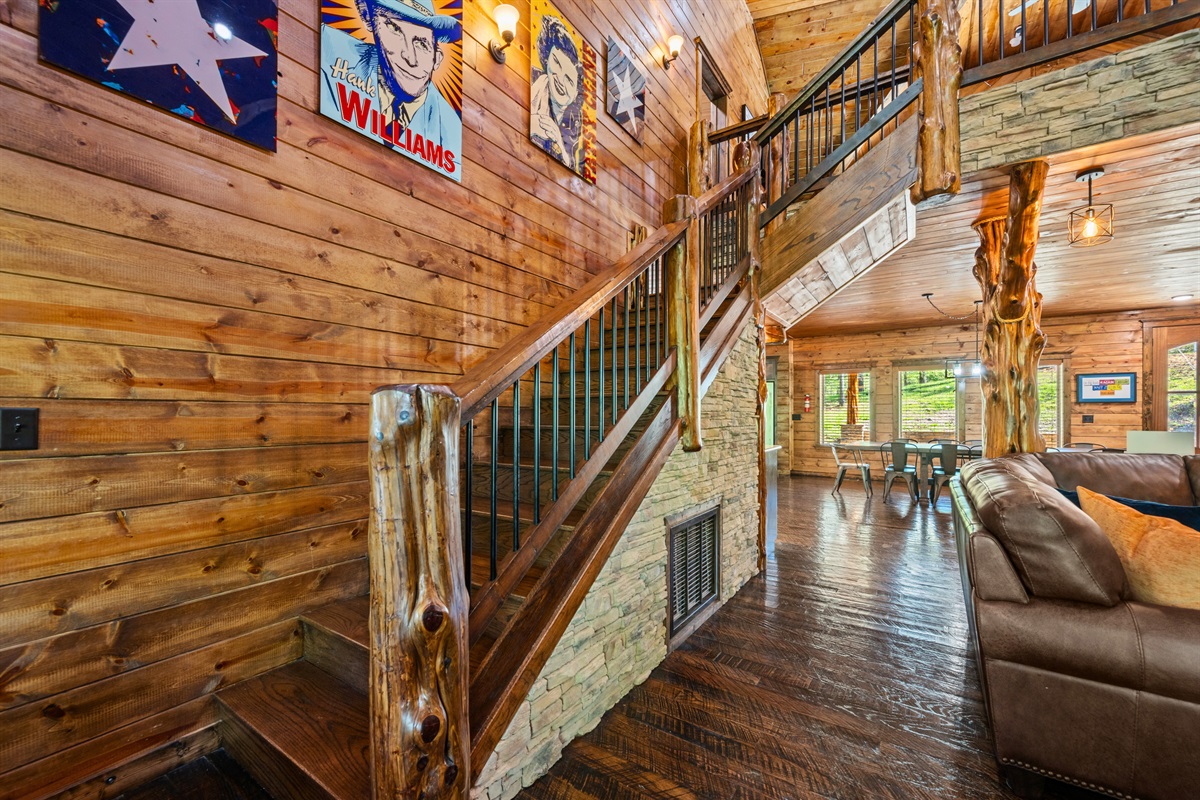 The staircase and loft area add architectural charm while leading you to an upper level filled with additional space for relaxing, entertaining, and enjoying time together.