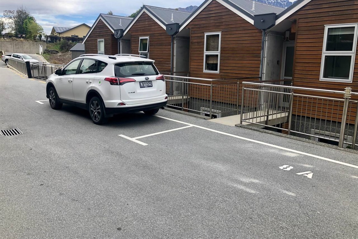 Assigned carpark space outside apartment (where Toyota is parked). 