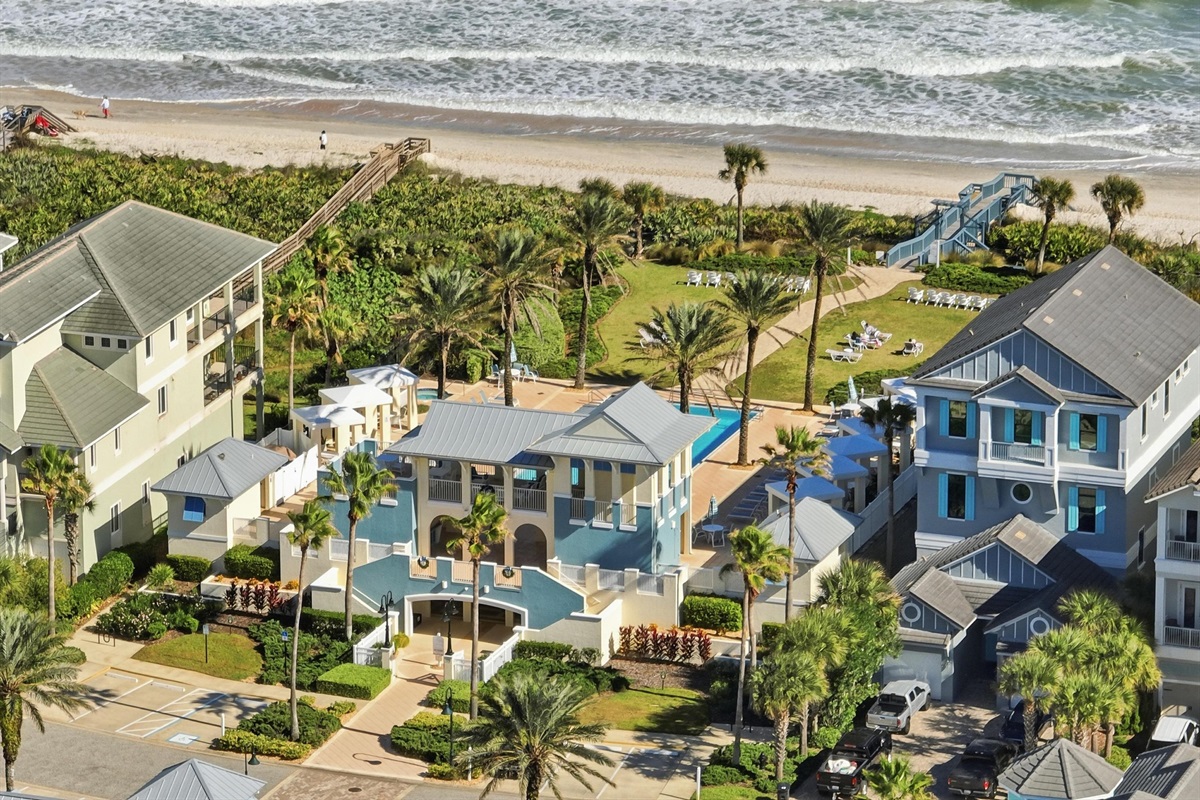 Steps from sand to serenity 🌊☀️
An aerial view of coastal living at its finest—lush grounds, resort-style amenities, and direct beach access just moments away. Wake up, walk out, and let the ocean set the pace.