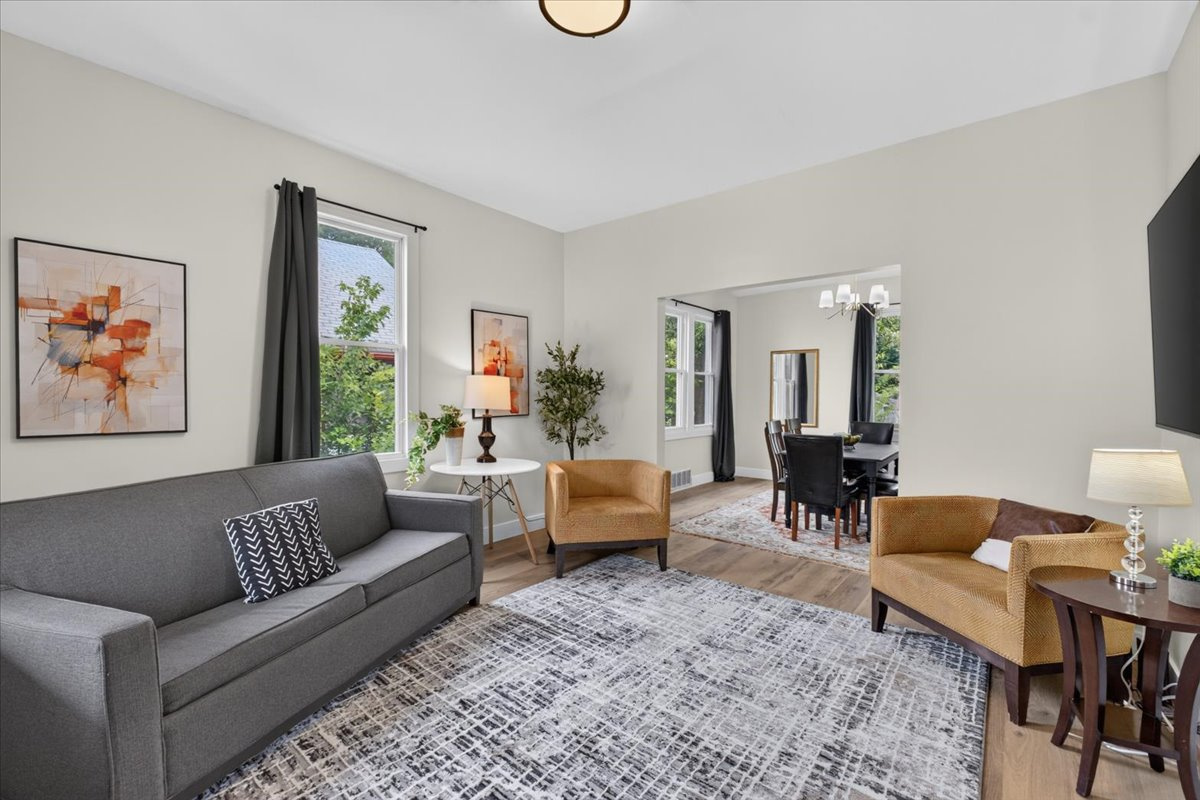 Comfortable and spacious living room with plenty of natural light.
