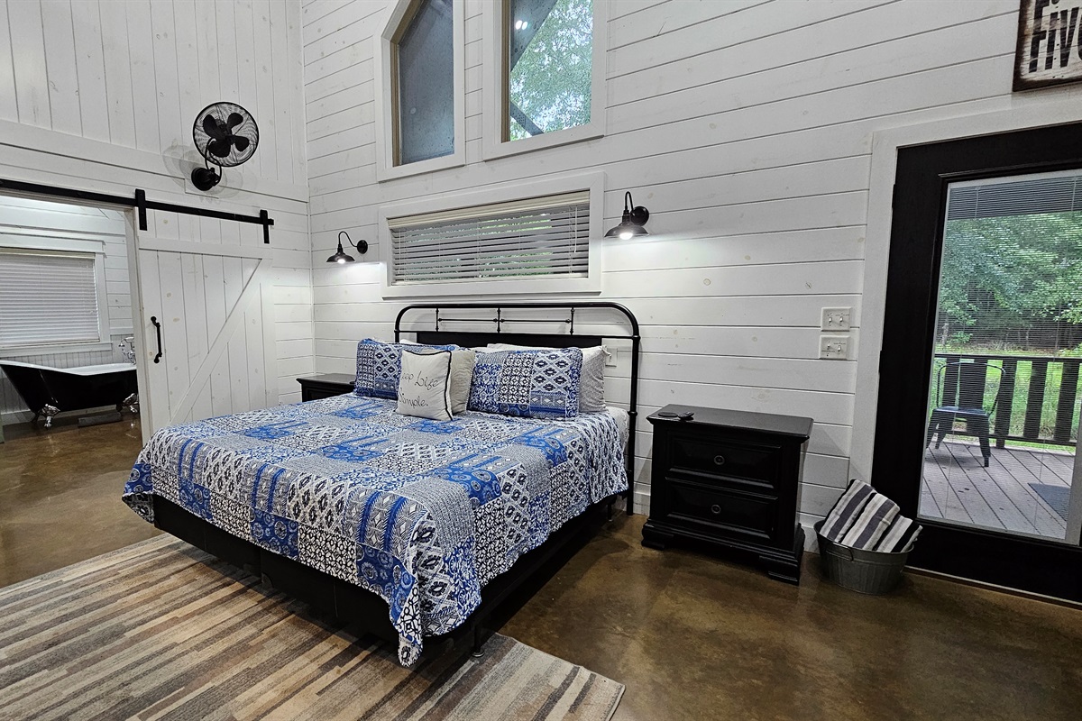 Charming Retreat: Relax in this stylish room with stunning stone accents and nature views!