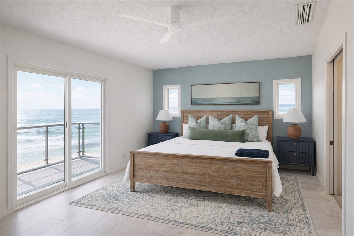 Wake up to ocean breezes and step outside for coffee or evening wine — this primary suite feels like a private retreat.