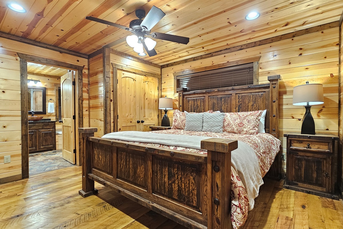 Bedroom 2: Rustic charm with wooden accents and plush bedding for a perfect getaway!
