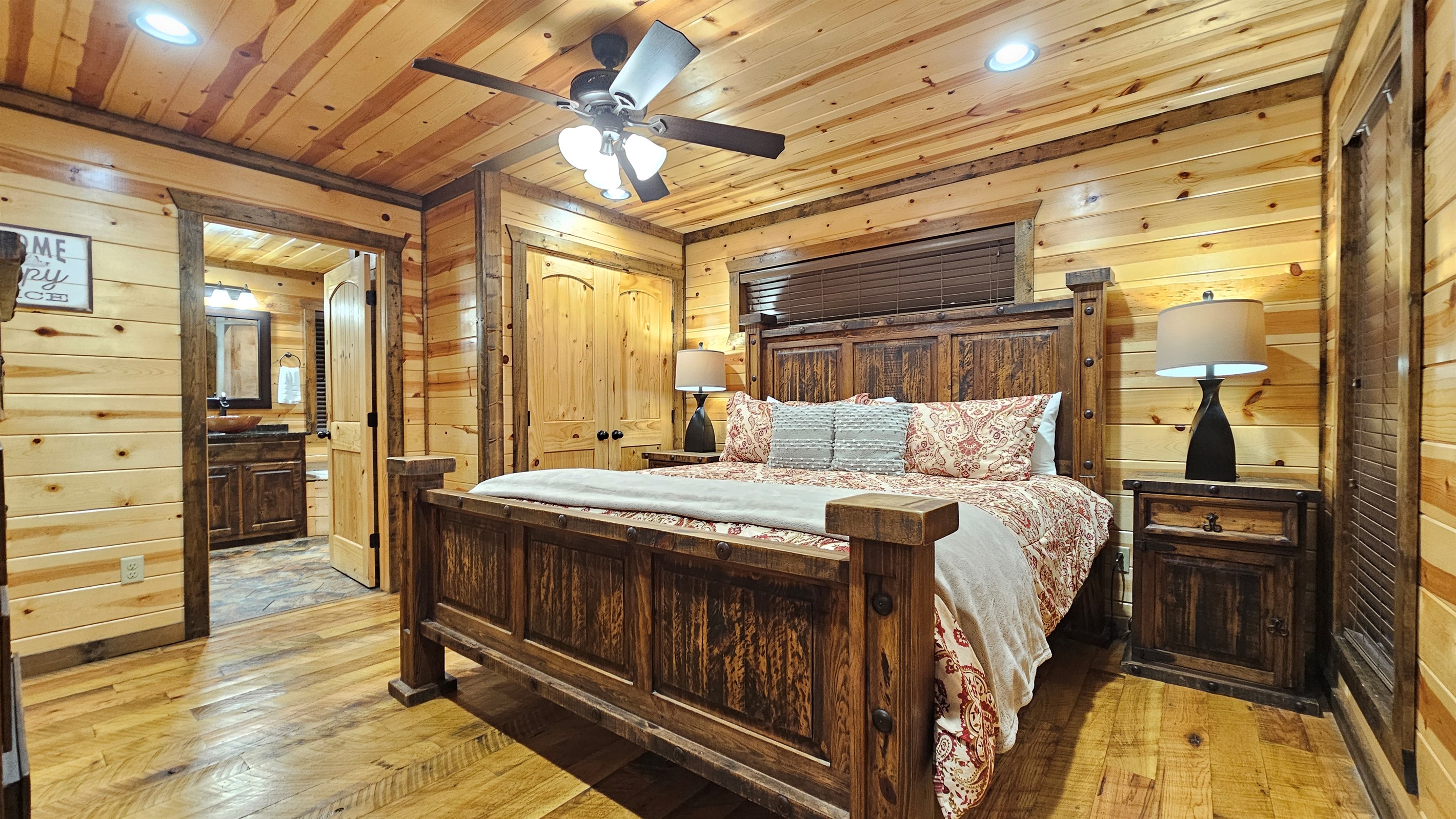 Bedroom 2: Rustic charm with wooden accents and plush bedding for a perfect getaway!