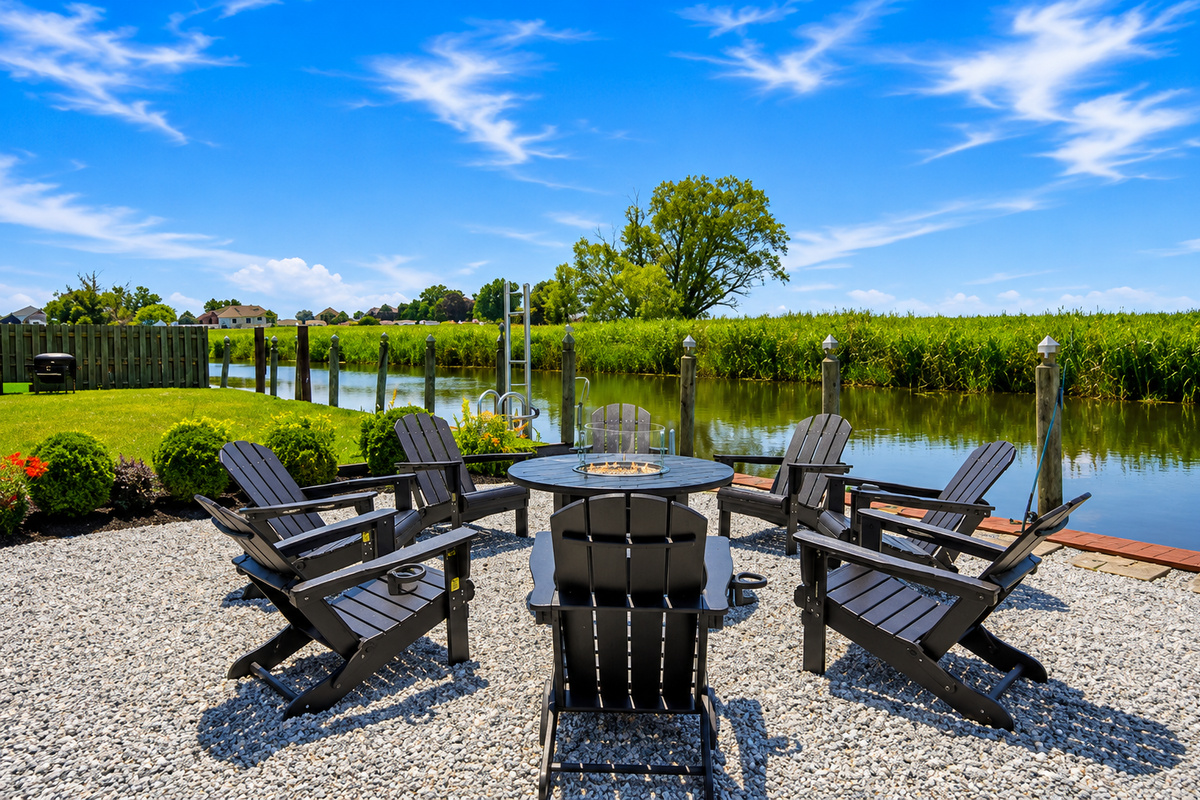 Gather around the waterfront fire pit with Adirondack chairs—the perfect spot to unwind, enjoy the views, and make memories day or night.