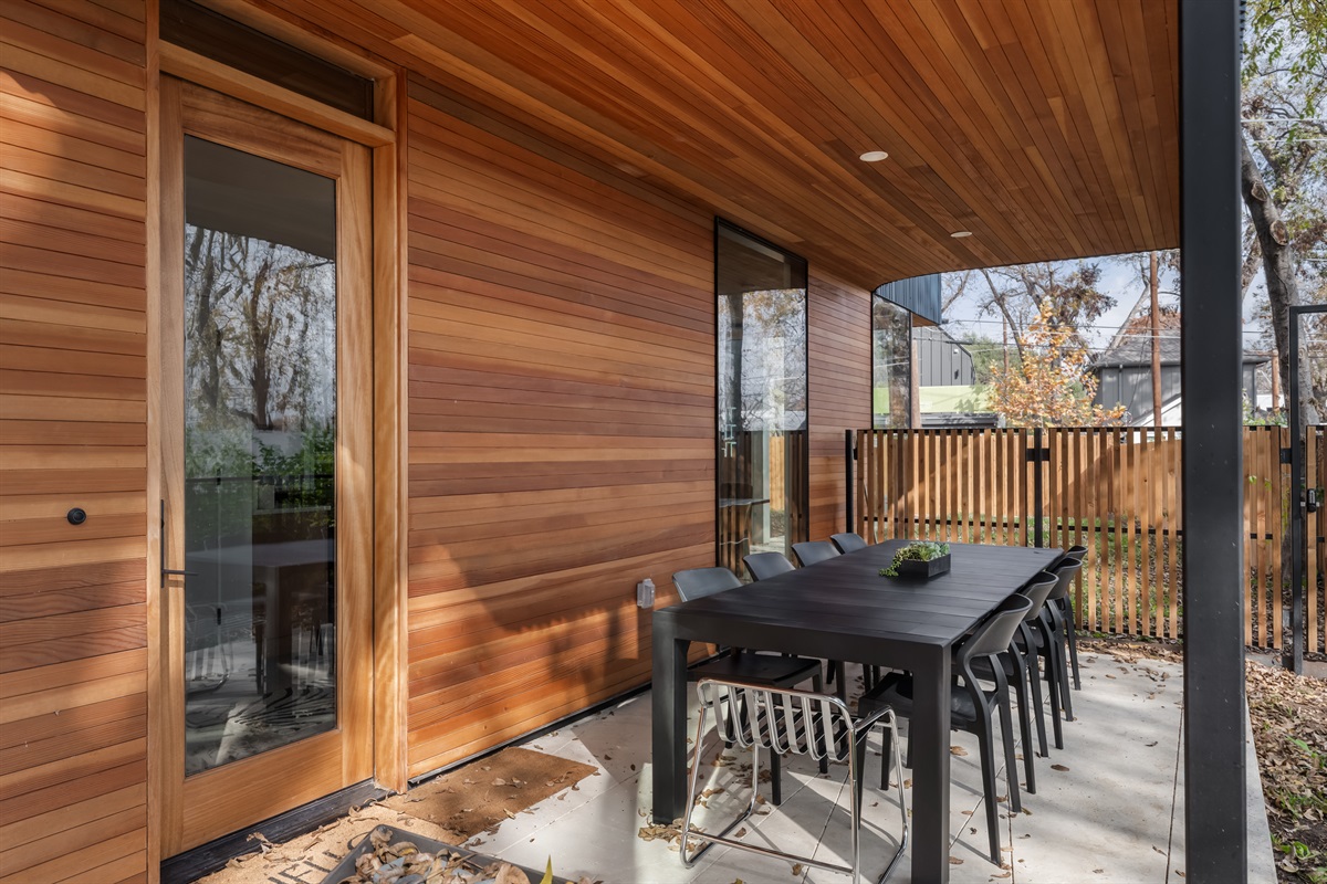 Shaded patio dining space just steps from the interior—perfect for effortless indoor-outdoor living.