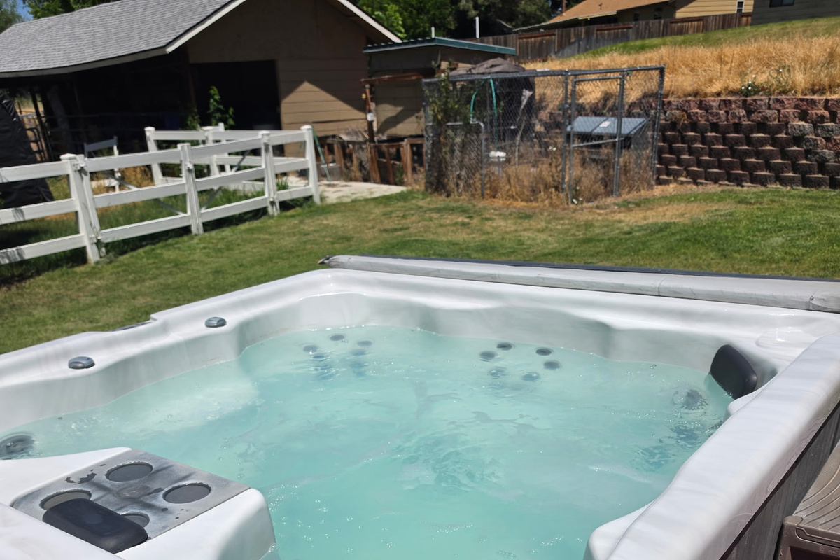 Well-maintained hot tub that comfortably accommodates up to eight adults.
