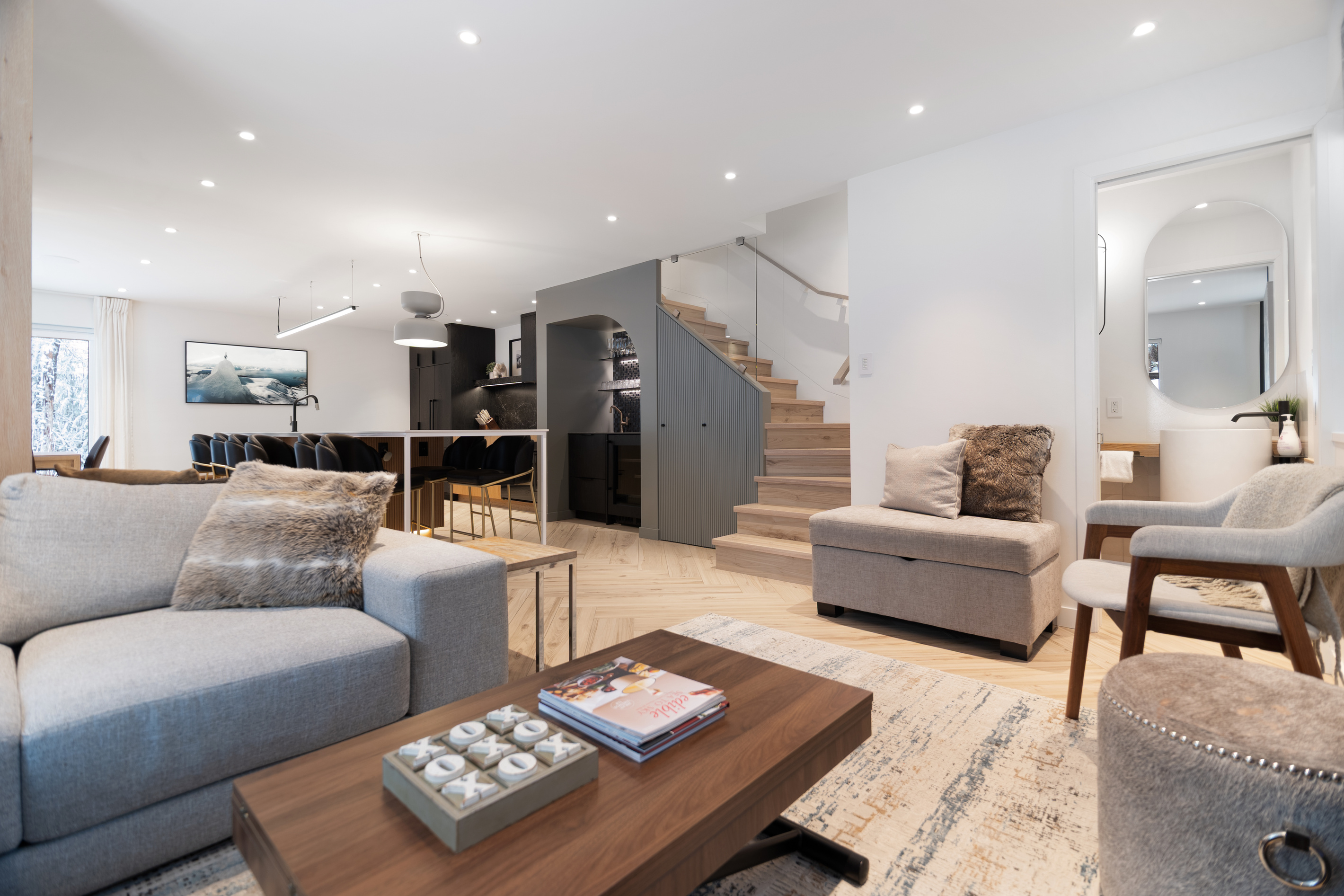Living room with stairs and coffee bar