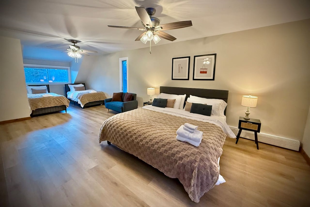 Bedroom with 1 King Bed and 2 Queen Beds