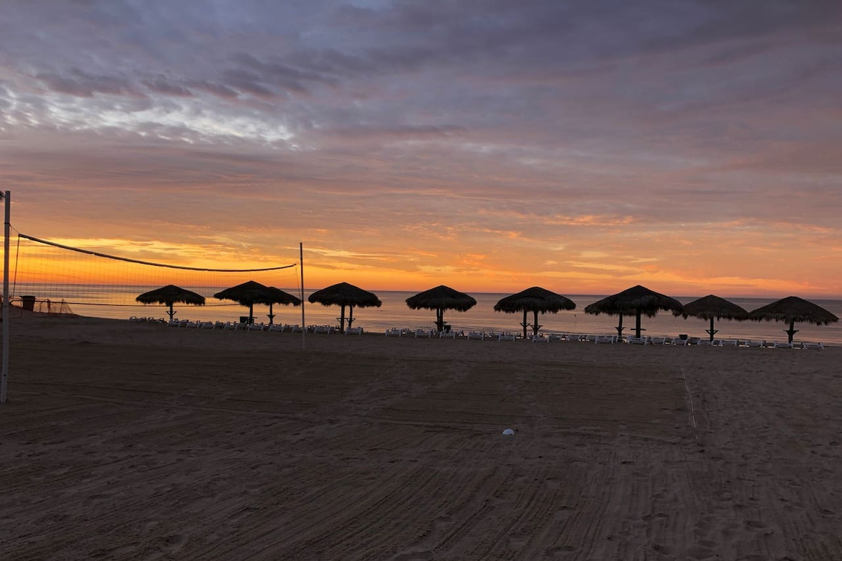 Lots of Palapas, lounge chairs, and even a sand volleyball court!