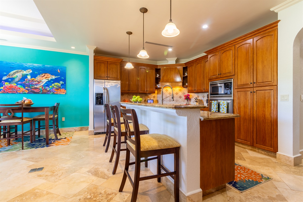 Gourmet kitchen with island and bar seating