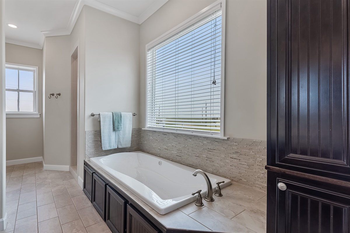 Master Bathroom #1: Roomy private bathtub and walk-in tiled shower.