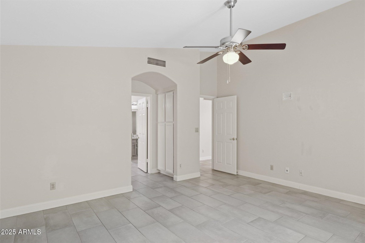 Primary Bedroom: Large Smart TV on Wall, En-Suite Bathroom