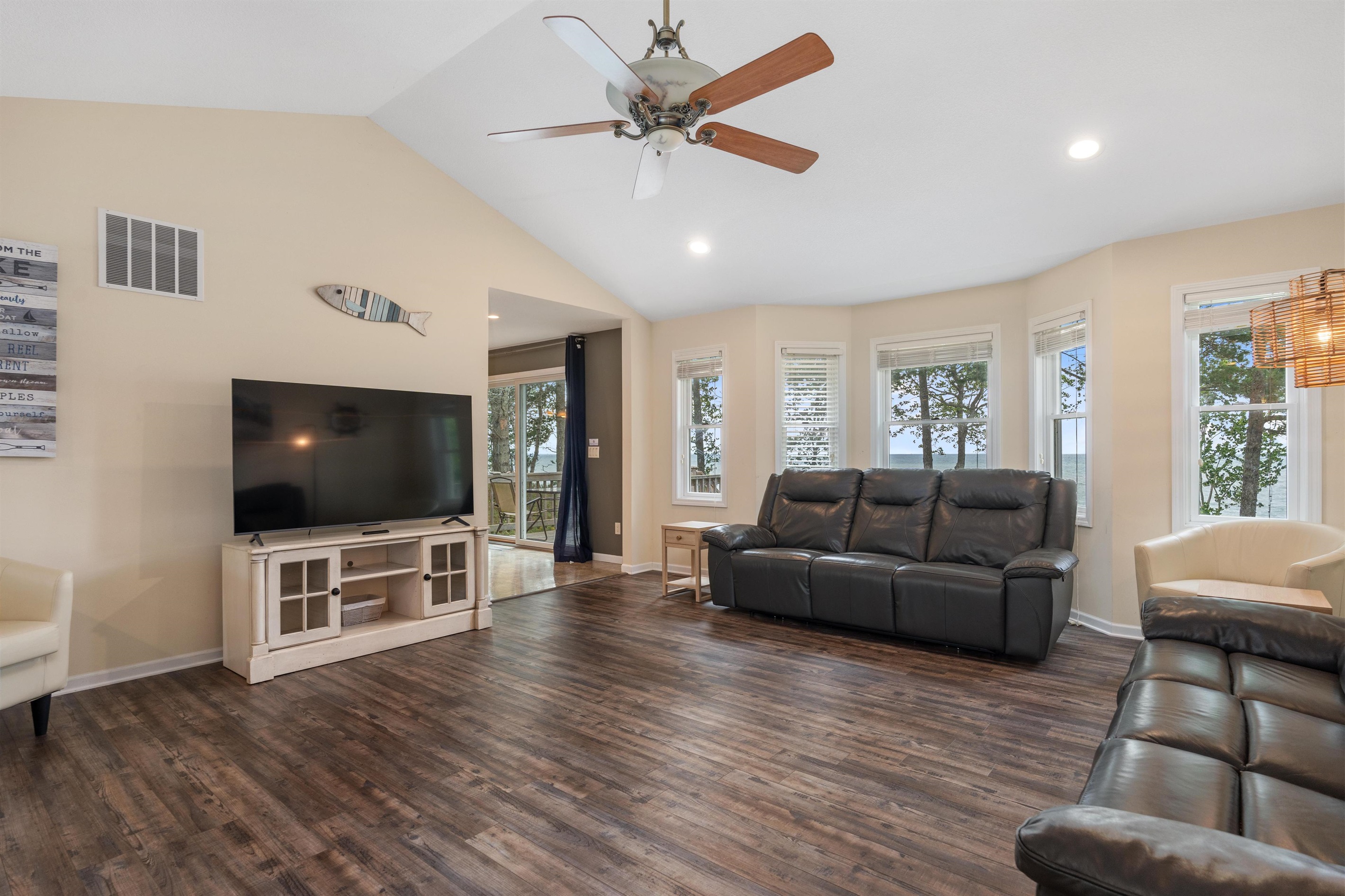 Huge, vaulted ceiling Living Room with 2 full sized leather sofa recliners and sitting chairs