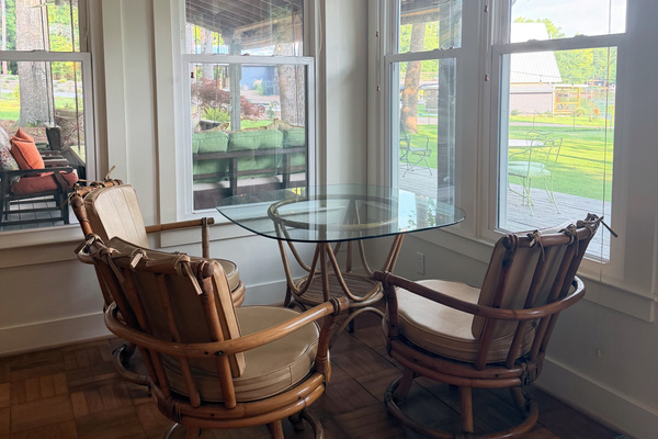 Sunroom seating with a peaceful lake view