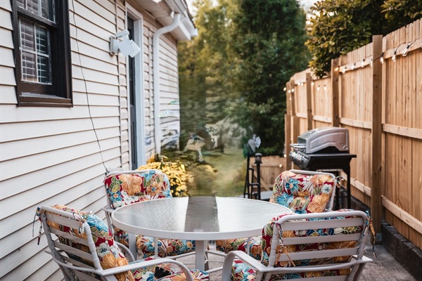 Private outdoor patio with grill.