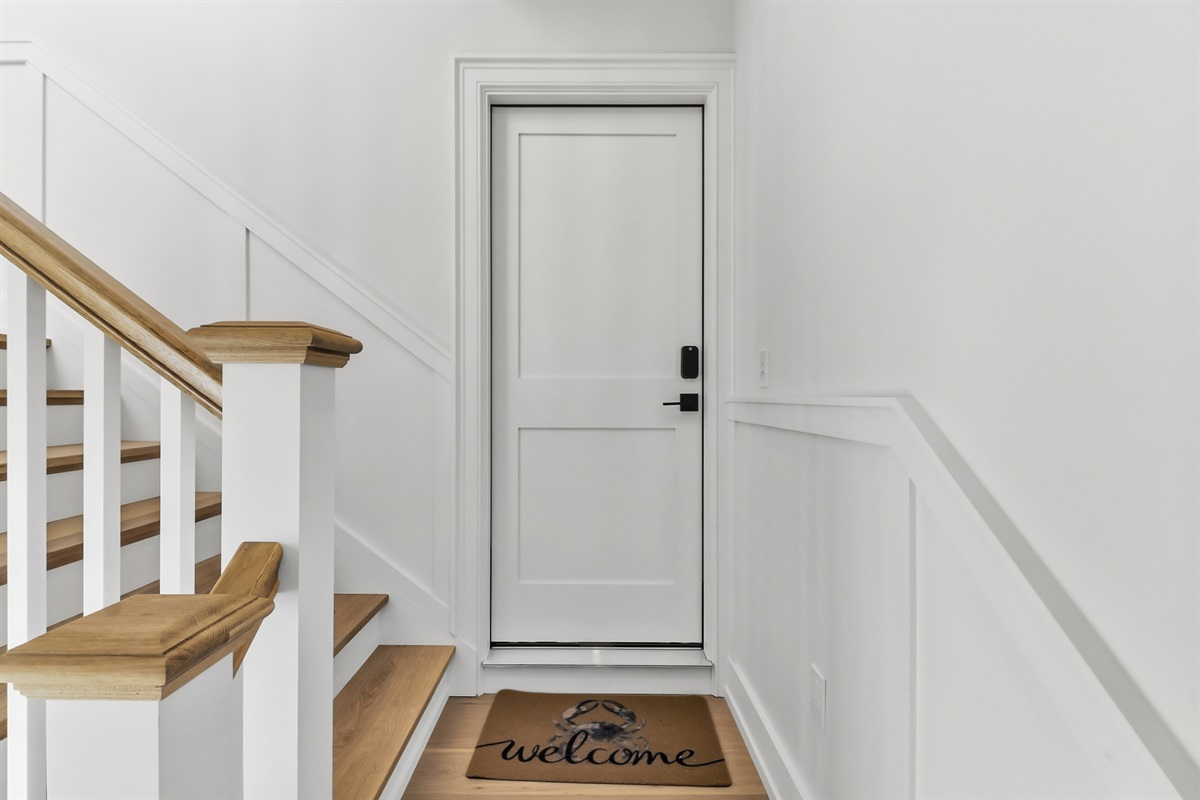 Stairs leading to the property's main door