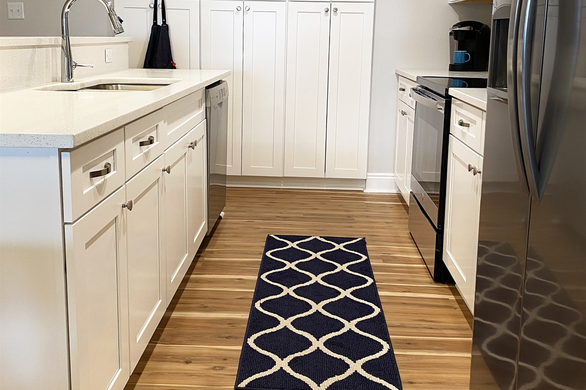 Brand new gorgeous kitchen. Spending time in here is a pleasure. We've got all the basics including: fresh apron, wine glasses, and plastic dishes for the kids.