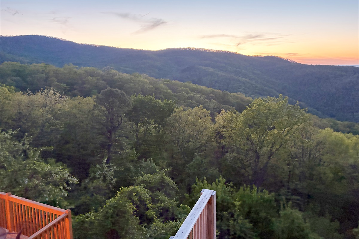 The view is the main event: rolling ridges, open sky, and total mountain calm.