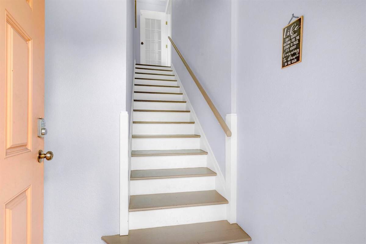 Private stairway from exterior ground entrance door to the upstairs home