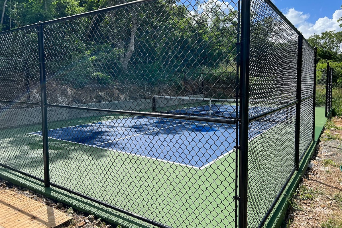 Private pickleball court shared with neighboring villa.