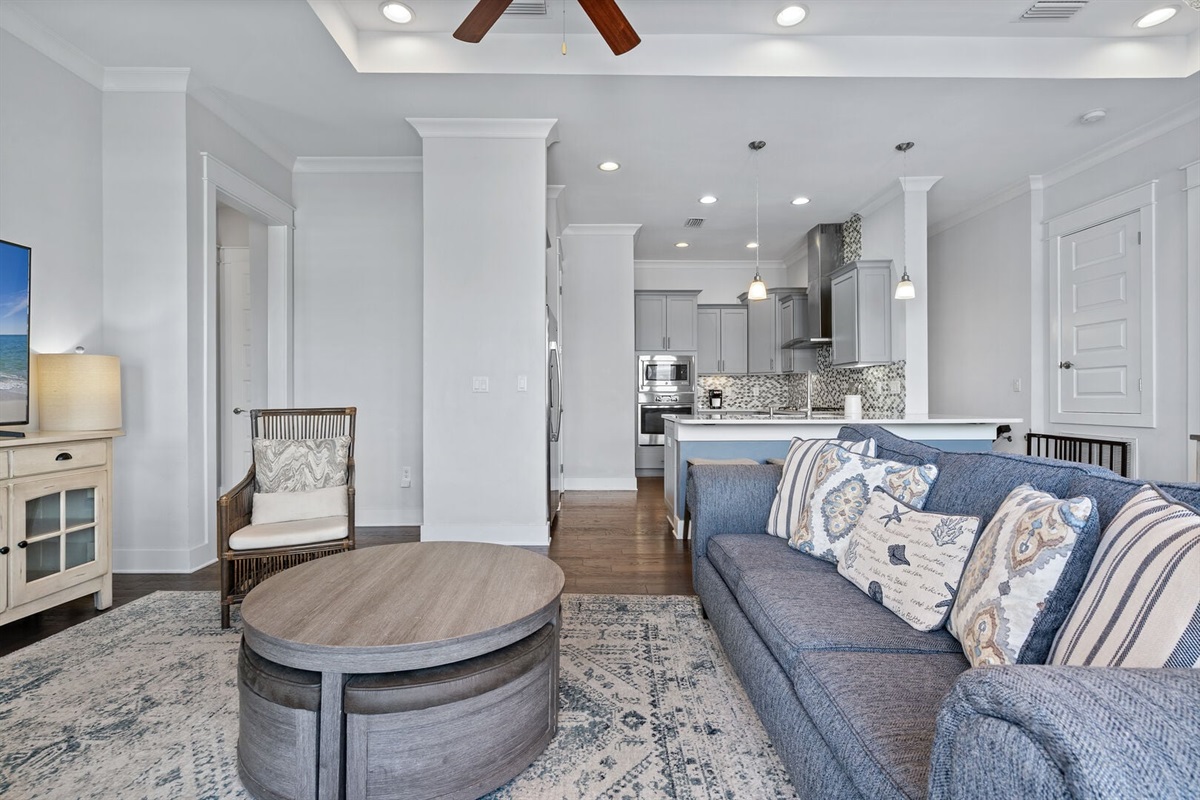 Comfortable living space flows to the kitchen.