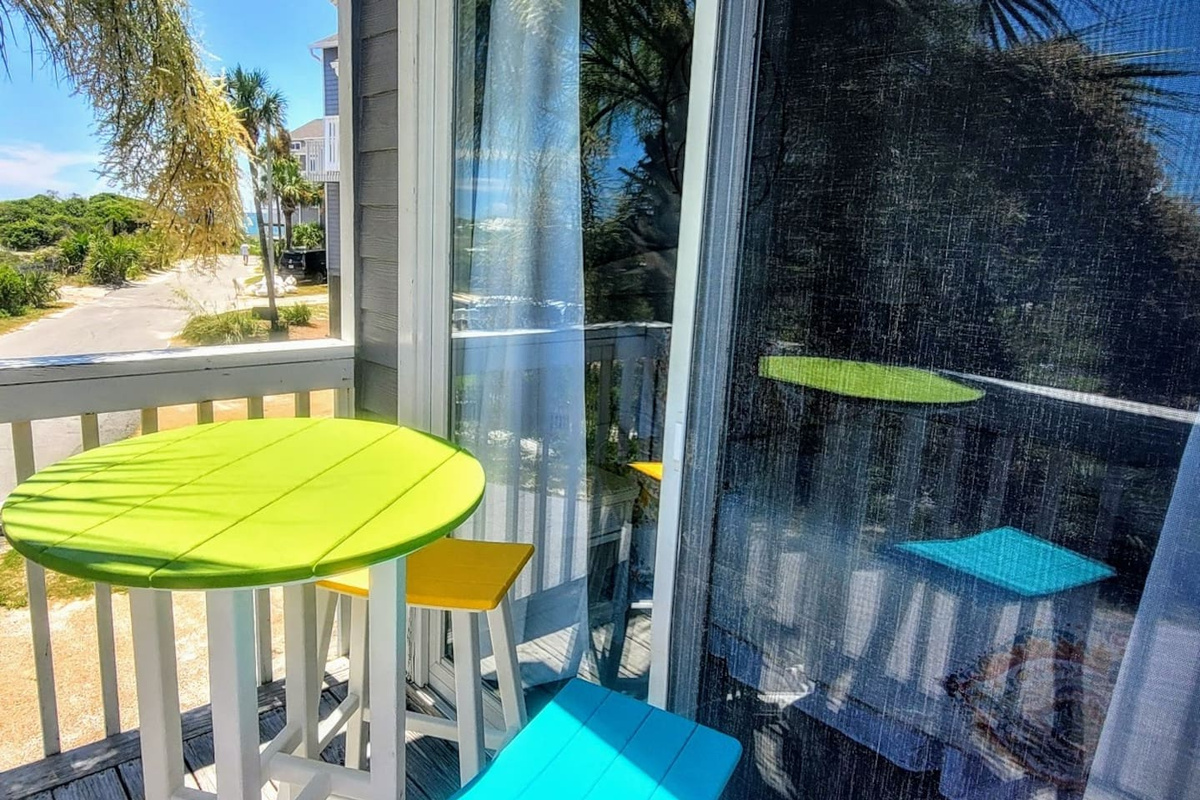 Step out to your own private balcony from the queen bedroom &mdash; morning coffee, Gulf air, just you.